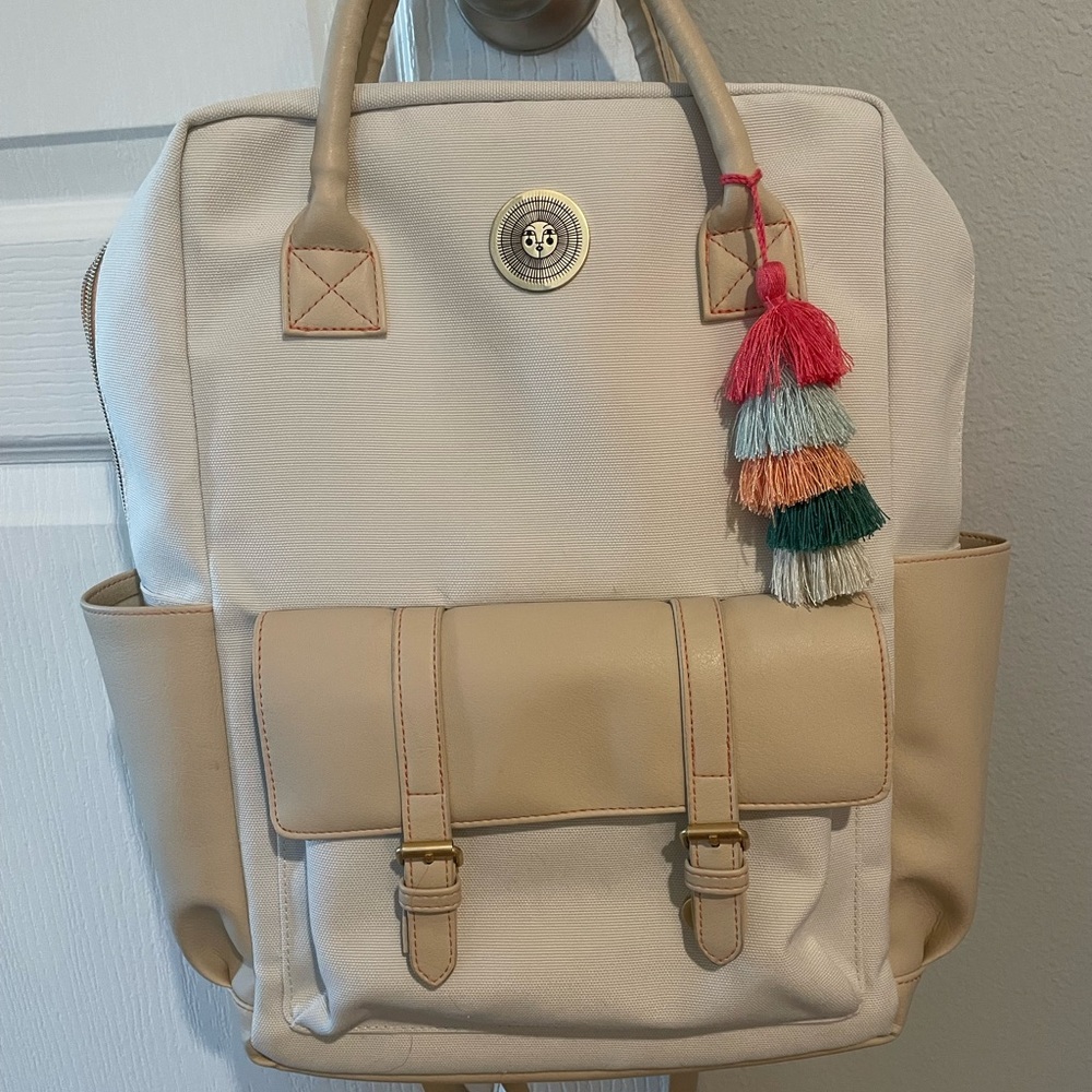 Cream Canvas Backpack with Tan Trim and Colorful Tassel
